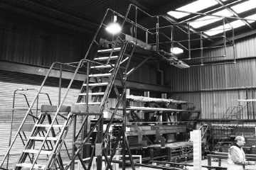 What Are the Benefits of Using Mobile Access Ladders in Warehouses